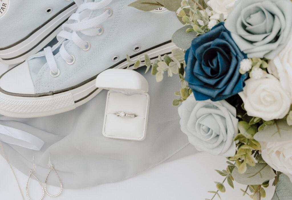wedding details: ring, shoes, and flowers